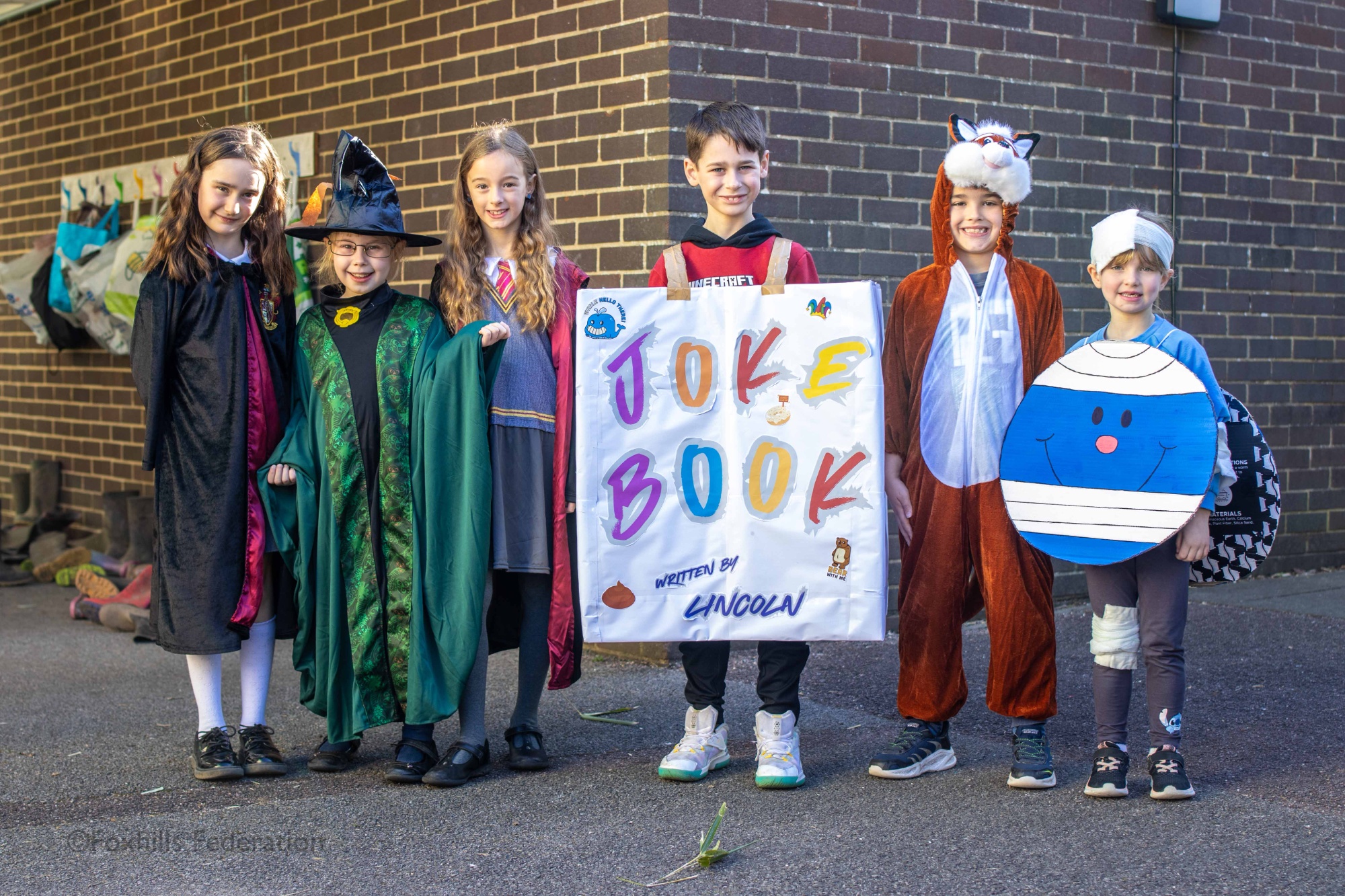 Children pose in outifts for World Book Day