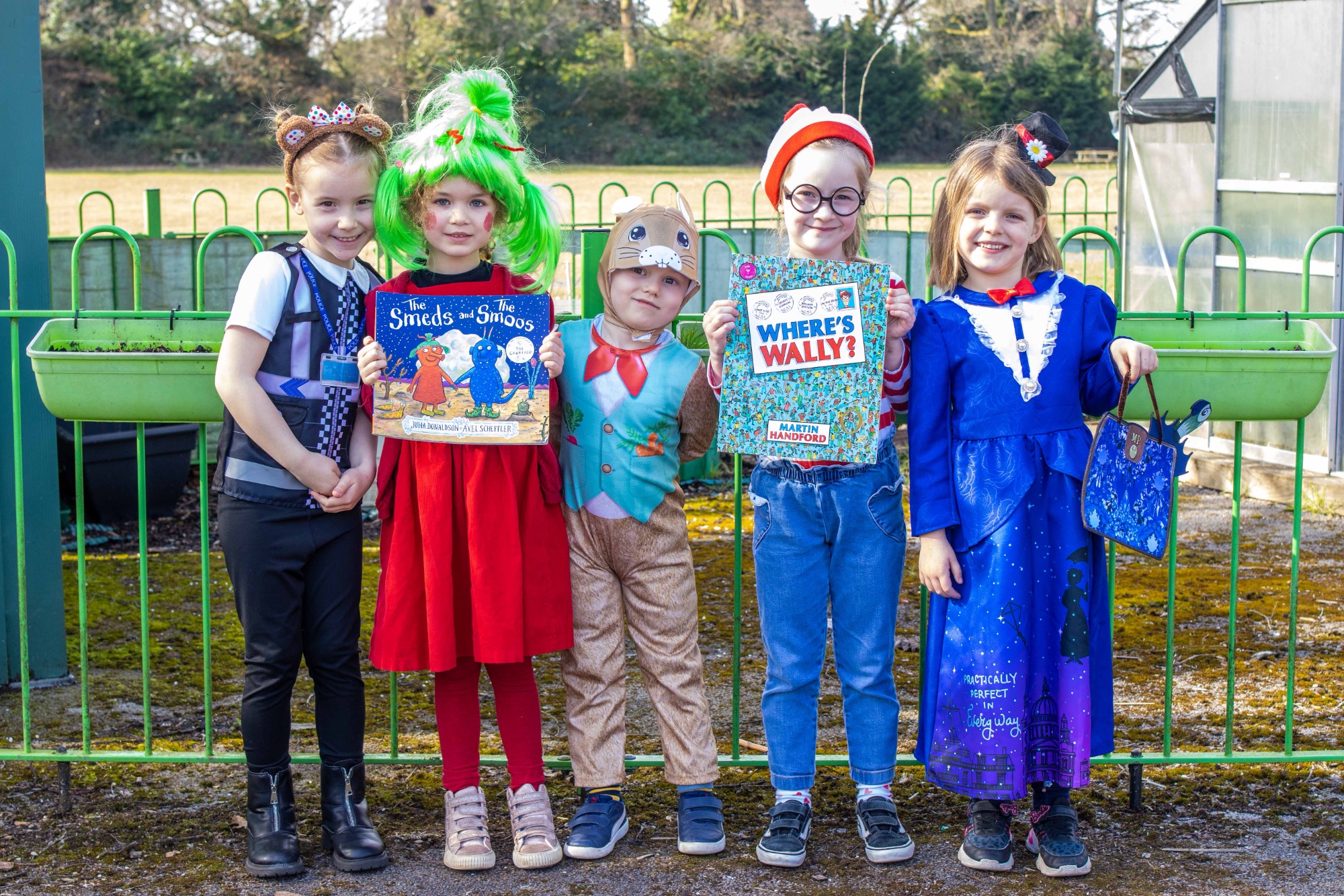 Children pose in outifts for World Book Day