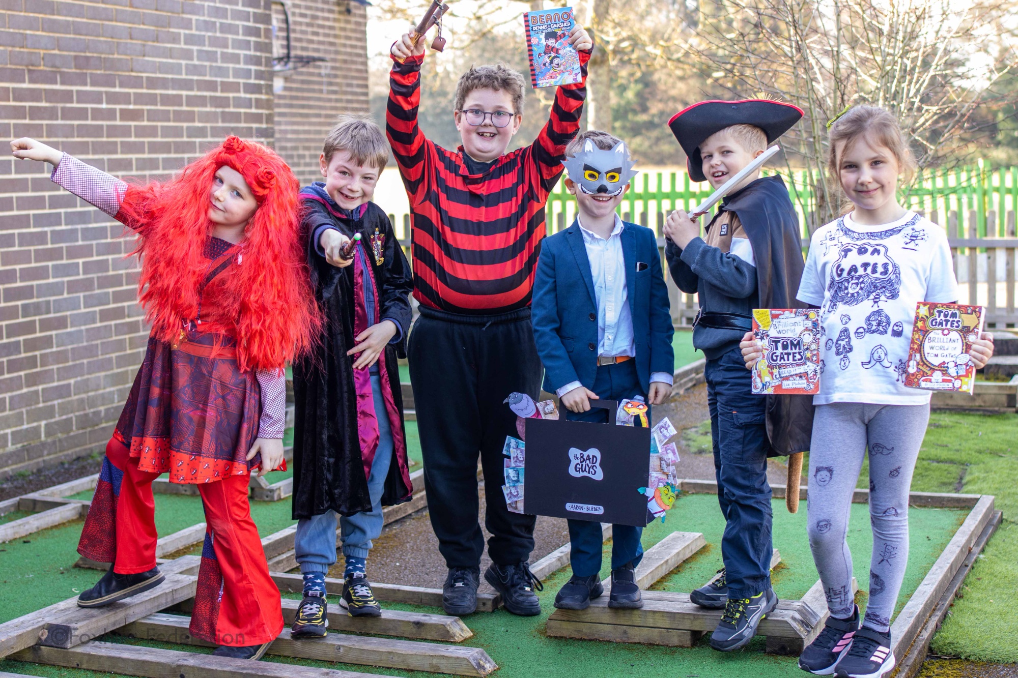 Children pose in outifts for World Book Day