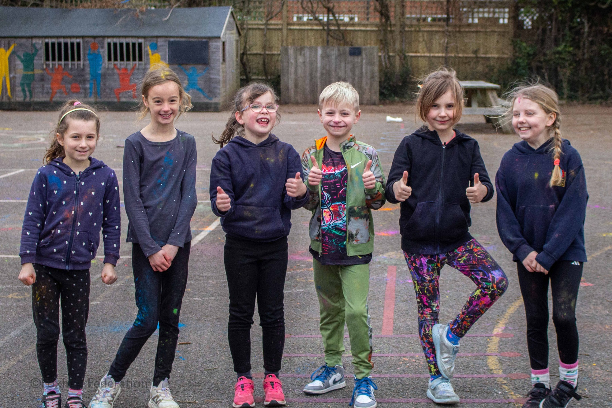 A group of children pose for the camera